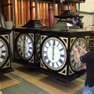 Fitting out pillar clock dial boxes in our factory